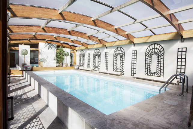 house with terrace and skylight over the pool