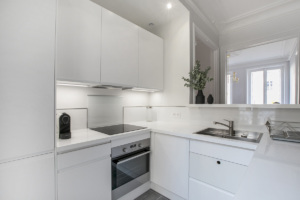 white light grey equipped kitchen furnished apartment Paris 7th