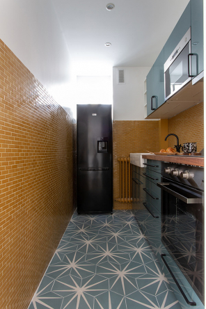 The vintage yellow backsplash in the kitchen was kept